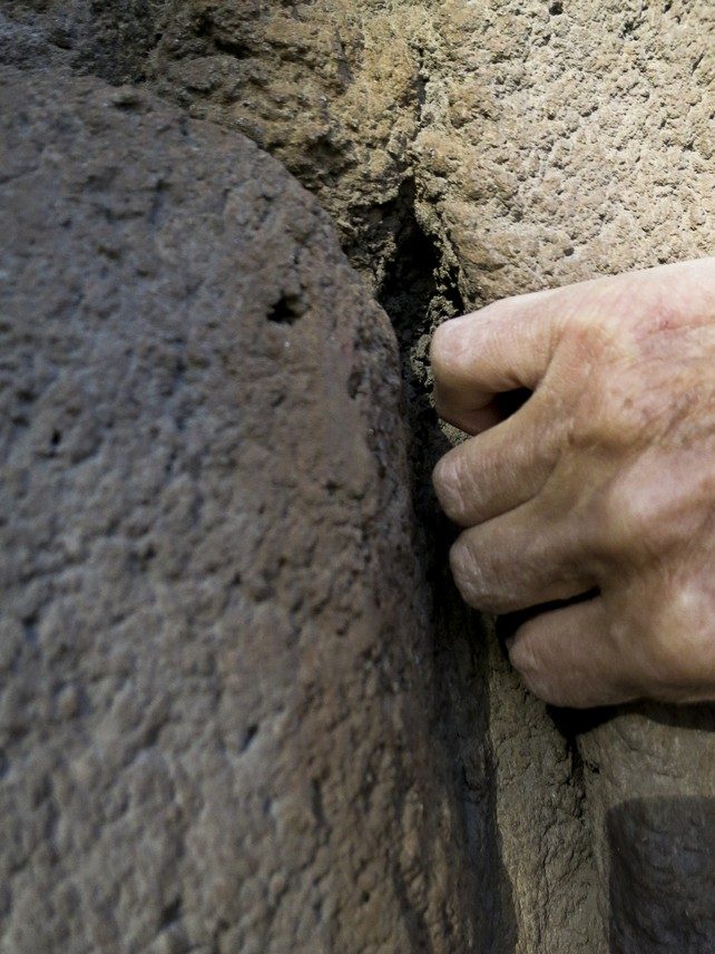 Hand in a sculpted crack