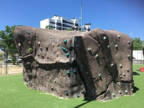 Sculpted concrete boulder on grass, Valdemoro