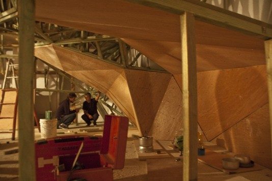 Wooden structure being assembled